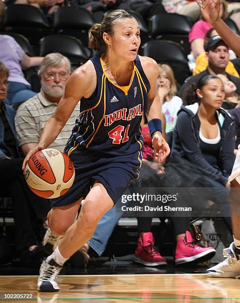 Tully Bevilaqua of the Indana Fever runs with the ball during a WNBA game against the Minnesota Lynx on June 6, 2010 at the Target Center in...