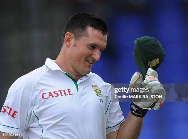 South African captain Graeme Smith celebrates after making a century on day one of the second test against the West Indies at the Warner Park ground...