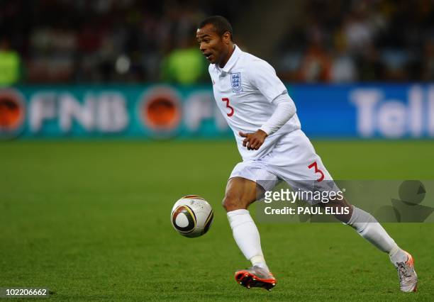 England's defender Ashley Cole kicks the ball during Group C first round 2010 World Cup football match on June 18, 2010 at Green Point stadium in...