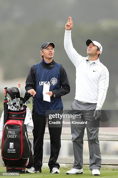 Paul Casey of England waits with his caddie Christian Donald on the seventh tee during the second round of the 110th U.S. Open at Pebble Beach Golf...