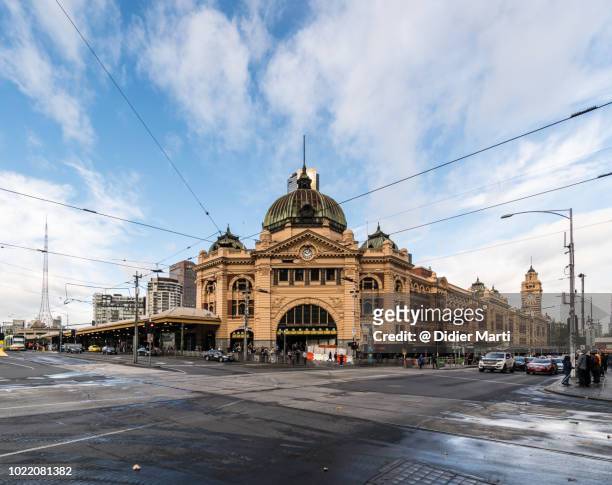 wide angle view of the famous flinders street railway station in the heart of melbourne in australia second largest city - melbourne australia stock pictures, royalty-free photos & images