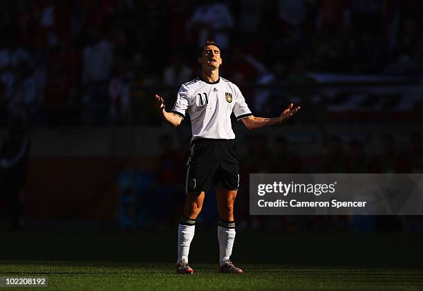 Miroslav Klose of Germany reacts after being sent off during the 2010 FIFA World Cup South Africa Group D match between Germany and Serbia at Nelson...