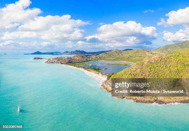 panoramic elevated view of turquoise caribbean sea of darkwood beach and valley road, antigua - antigua stock-fotos und bilder