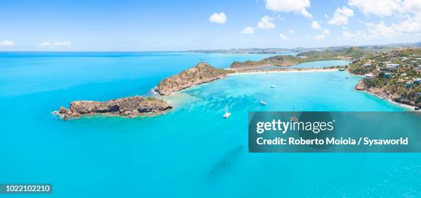 panoramic elevated view of crystalline turquoise sea and sand beach of deep bay, antigua, antigua and barbuda, caribbean, leeward islands, west indies - antigua and barbuda stock pictures, royalty-free photos & images