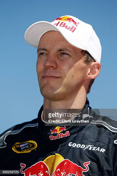 Mattias Ekstrom, driver of the Red Bull Toyota, stands on pit lane during qualifying for the NASCAR Sprint Cup Series Toyota/Save Mart 350 at...