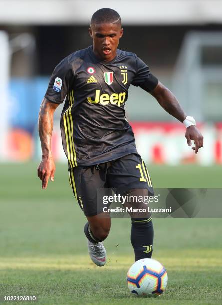 Douglas Costa of Juventus FC in action during the Serie A match between Chievo Verona and Juventus at Stadio Marc'Antonio Bentegodi on August 18,...