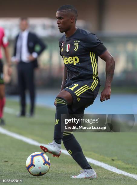 Douglas Costa of Juventus FC in action during the Serie A match between Chievo Verona and Juventus at Stadio Marc'Antonio Bentegodi on August 18,...