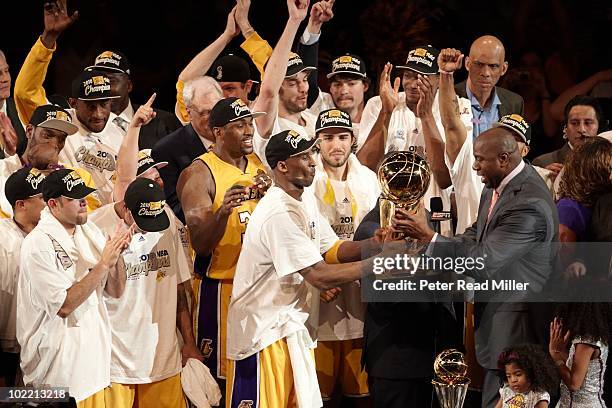 Finals: Los Angeles Lakers Kobe Bryant celebrates with trophy and former Los Angeles Lakers Magic Johnson after winning Game 7 and championship...