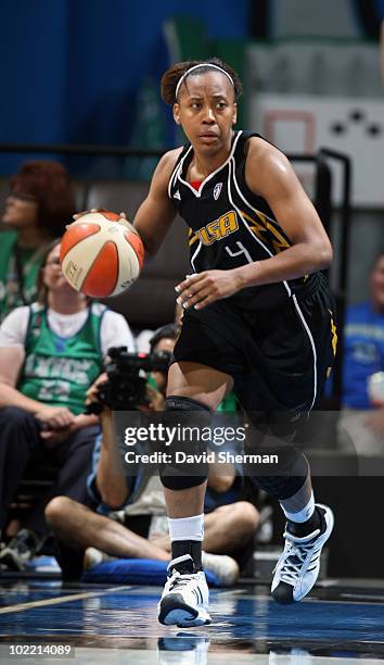 Amber Holt of the Tulsa Shock dribbles up court against the Minnesota Lynx during the game on June 18, 2010 at the Target Center in Minneapolis,...