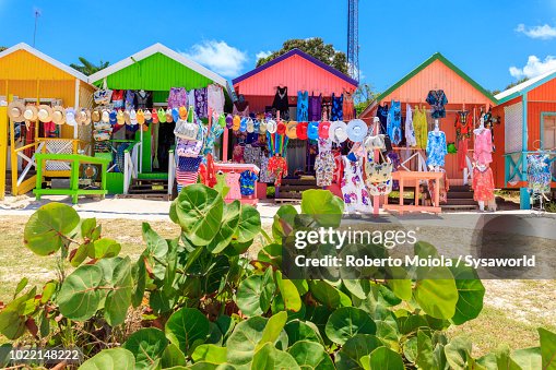 Multi colored wood cottages and tourist souvenir shops, Long Bay Beach, Antigua Multi colored wood cottages and tourist souvenir shops, Long Bay Beach, Antigua