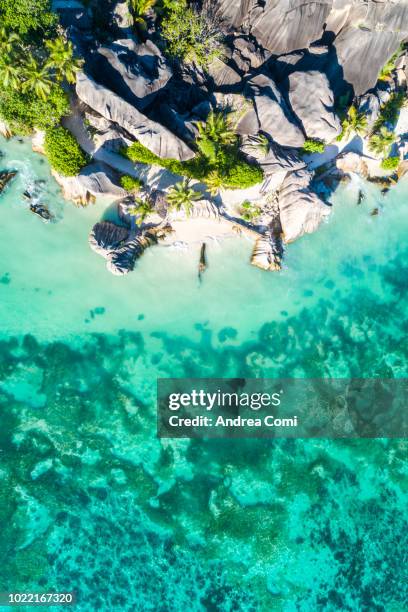 aerial view of anse source d'argent beach at sunset - natural landmark stock-fotos und bilder