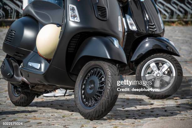 two black scooters parked in hamburg, germany - 4 wheel motorbike stock pictures, royalty-free photos & images