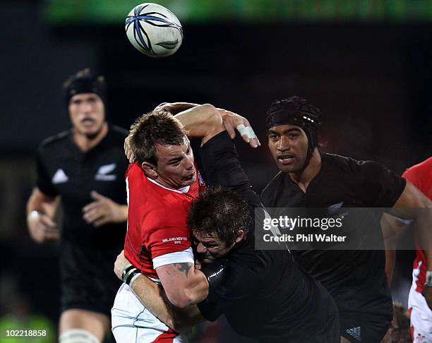 Richie McCaw of the All Blacks tackles Matthew Rees of Wales during the First Test match between the New Zealand All Blacks and Wales at Carisbrook...
