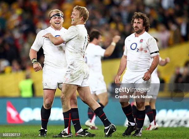 Dan Cole and Lewis Moody of England celebrate after winning the Cook Cup Test Match between the Australian Wallabies and England at ANZ Stadium on...