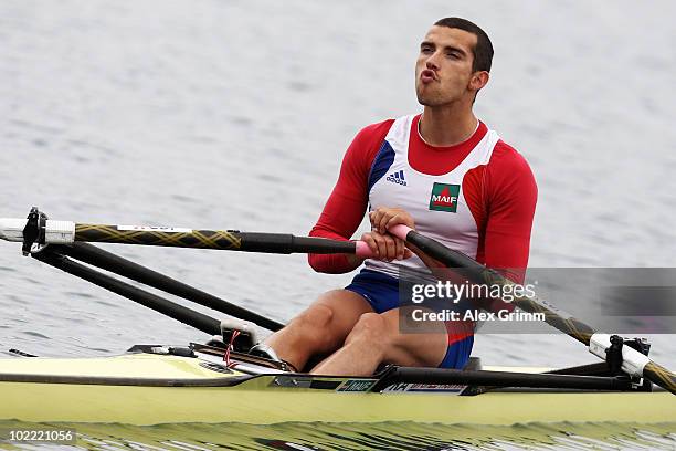 Maxime Goisset of France prepares for the semifinal of the men's lightweight single sculls during the FISA Rowing World Cup on June 19, 2010 in...
