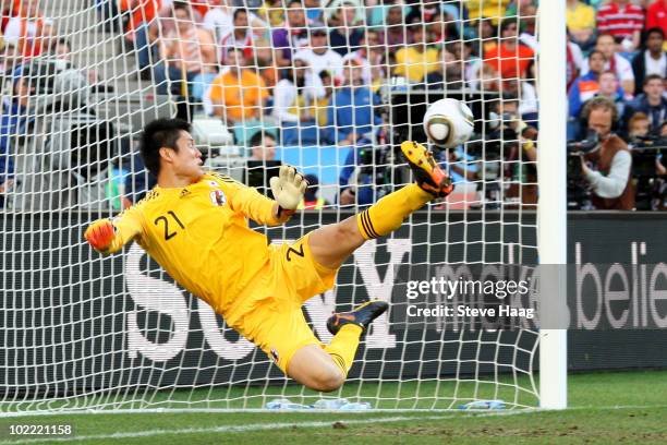 Eiji Kawashima of Japan looks on as a shot from Wesley Sneijder of the Netherlands hits the back of the net during the 2010 FIFA World Cup South...