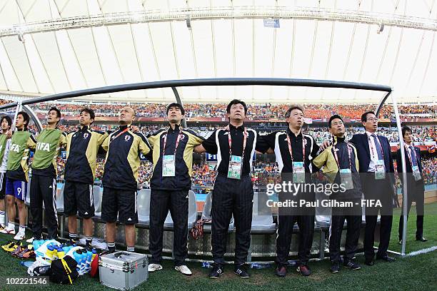 The Japan team stands for the national anthem prior to the 2010 FIFA World Cup South Africa Group E match between Netherlands and Japan at Durban...