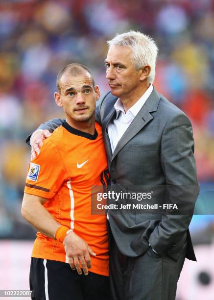 Wesley Sneijder of the Netherlands and head coach Bert van Marwijk celebrate their victory after the 2010 FIFA World Cup South Africa Group E match...