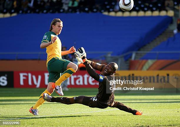 Brett Holman of Australia lifts the ball over Richard Kingson of Ghana and scores the opening goal during the 2010 FIFA World Cup South Africa Group...