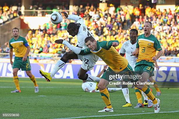 Prince Tagoe of Ghana and Brett Emerton of Australia battle for the ball during the 2010 FIFA World Cup South Africa Group D match between Ghana and...