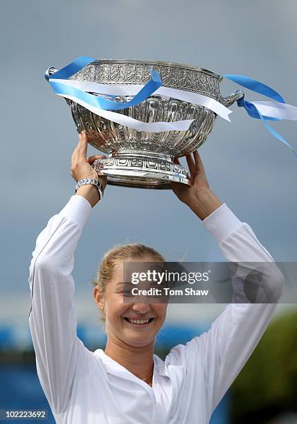 Ekaterina Makarova of Russia poses with the trophy after winning the womens final against Victoria Azarenka of Belarus during day six of the AEGON...