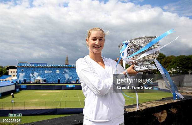 Ekaterina Makarova of Russia poses with the trophy after winning the womens final against Victoria Azarenka of Belarus during day six of the AEGON...