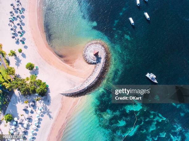 bali coast with a figurative breakwater aerial view - sanur stock pictures, royalty-free photos & images