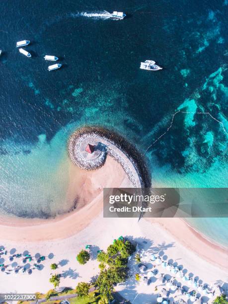 bali coast with a figurative breakwater aerial view - nusa dua stock pictures, royalty-free photos & images