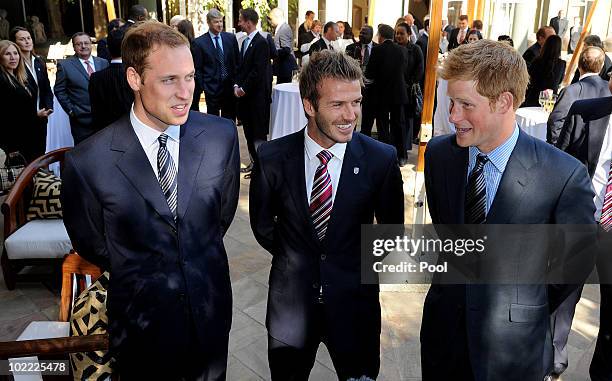 Prince William speaks to David Beckham and Prince Harry at an FA reception at the Saxon Hotel on June 19, 2010 in Johannesberg, South Africa.