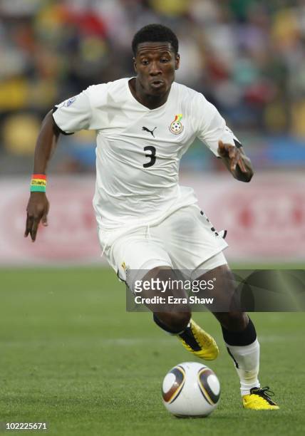 Asamoah Gyan of Ghana runs with the ball during the 2010 FIFA World Cup South Africa Group D match between Ghana and Australia at the Royal Bafokeng...