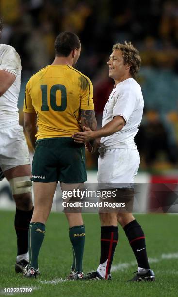 Jonny Wilkinson of England commiserates with Quade Cooper during the Cook Cup Test Match between the Australian Wallabies and England at ANZ Stadium...