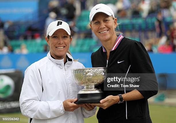 Lisa Raymond of USA and Rennae Stubbs of Australia pose with the trophy after winning the womens doubles during day six of the AEGON International at...