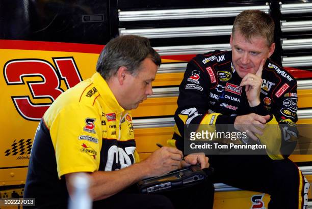 Jeff Burton driver of the CAT Chevrolet talks with a crew member during practice for the NASCAR Sprint Cup Series Toyota/Save Mart 350 at Infineon...