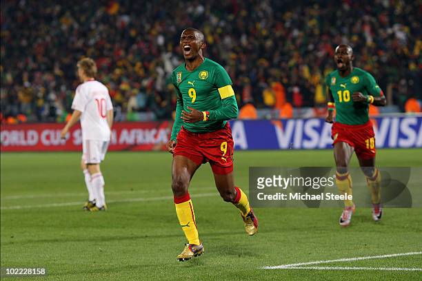 Samuel Eto'o of Cameroon celebrates scoring the first goal with team mate Achille Emana during the 2010 FIFA World Cup South Africa Group E match...