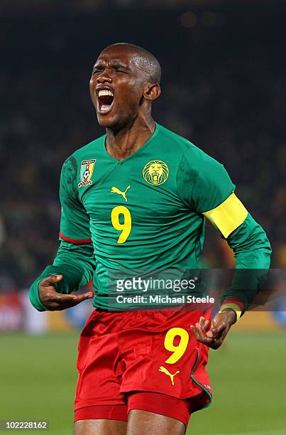 Samuel Eto'o of Cameroon celebrates scoring the first goal during the 2010 FIFA World Cup South Africa Group E match between Cameroon and Denmark at...