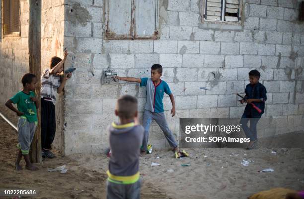 Palestinian children seen playing with toy guns during the Eid al-Adha holiday. The Gaza strip is located in the Southern part of Israel, it has been...