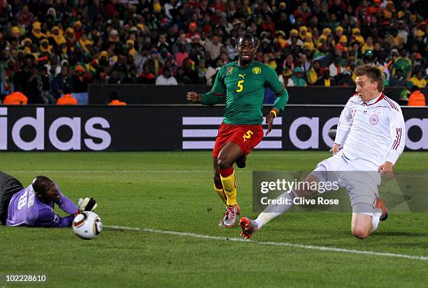 Nicklas Bendtner of Denmark scores past Hamidou Souleymanou of Cameroon during the 2010 FIFA World Cup South Africa Group E match between Cameroon...