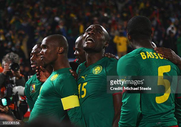 Samuel Eto'o of Cameroon celebrates his goal with team mates Pierre Webo and Sebastien Bassong during the 2010 FIFA World Cup South Africa Group E...