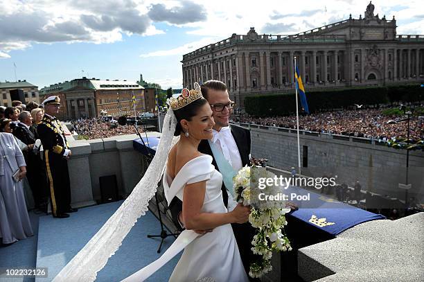 Crown Princess Victoria of Sweden and Prince Daniel, Duke of Vastergotland appear on the balcony to acknowledge spectators at The Royal Palace in...