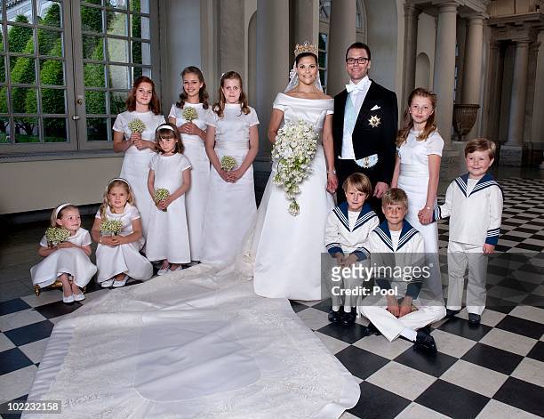 Crown Princess Victoria of Sweden and Prince Daniel, Duke of Vastergotland pose after their wedding with bridesmaids and page boys Vera Blom,...