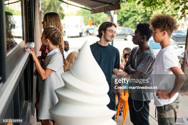 customer service in artisanal ice cream parlor. - montreal street stock pictures, royalty-free photos & images