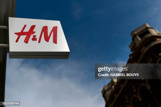 Picture shows the logo of Swedish fashion retailer H&M in Madrid on August 23, 2018.