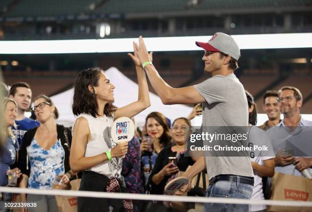 Mila Kunis and Ashton Kutcher play ping pong at Clayton Kershaw's 6th Annual Ping Pong 4 Purpose on August 23, 2018 in Los Angeles, California.