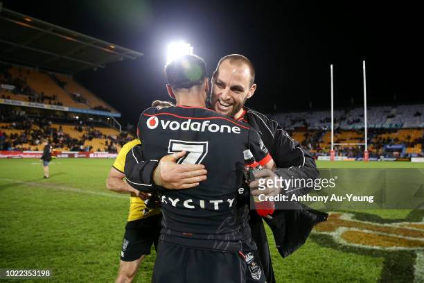 Simon Mannering and Shaun Johnson of the Warriors celebrate after winning the round 24 NRL match between the New Zealand Warriors and the Penrith...