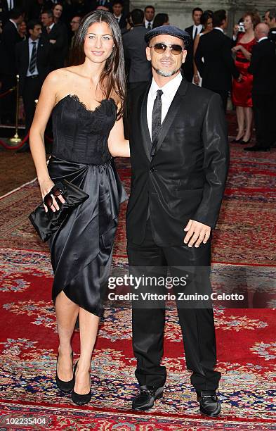 Marica Pellegrini and Eros Ramazzotti attend the Dolce & Gabbana "20 Years of Menswear" during Milan Fashion Week Spring/Summer 2011 on June 19, 2010...