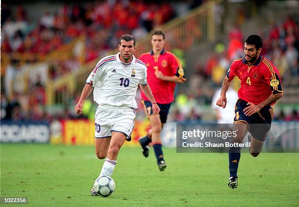 Zinedine Zidane of France beats Josep Guardiola of Spain during the European Championships 2000 Quarter Finals match at the Jan Breydel Stadium,...