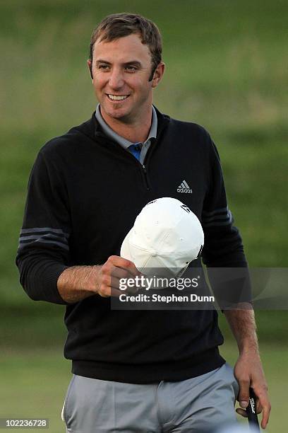 Dustin Johnson waves to the gallery on the 18th green after a five-under par 66 during the third round of the 110th U.S. Open at Pebble Beach Golf...