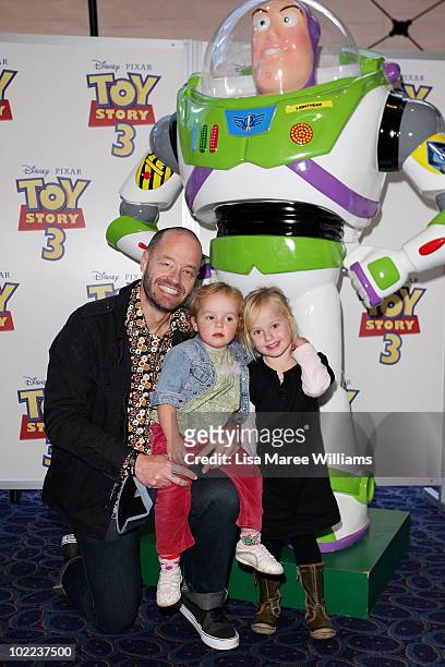 Adam Spencer arrives with his children for the premiere of "Toy Story 3" at IMAX Darling Harbour on June 20, 2010 in Sydney, Australia.