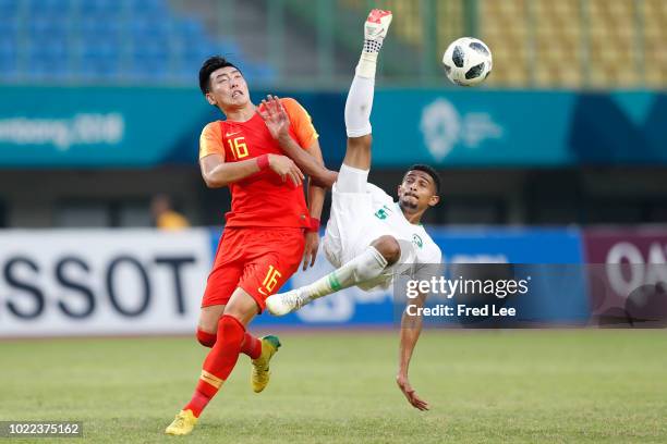 Zhang Yuan of China in action during the Men's Football round of 16 match between China and Saudi Arabia at the Patriot Chandrabhhaga Stadium on day...