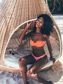 Woman in the Maldives island beach hammock
